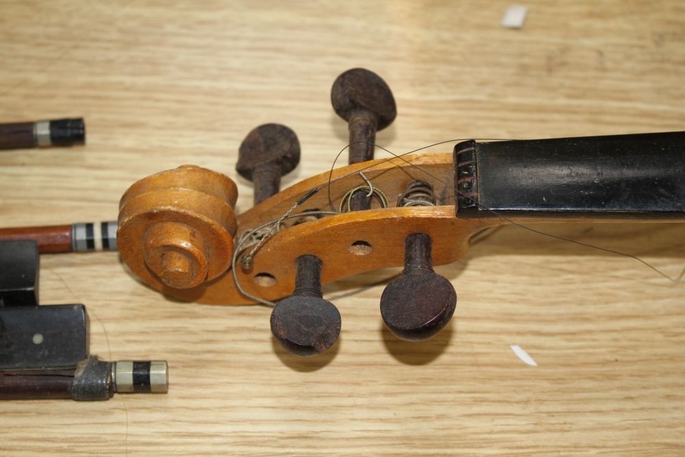 A Chinese violin and four bows